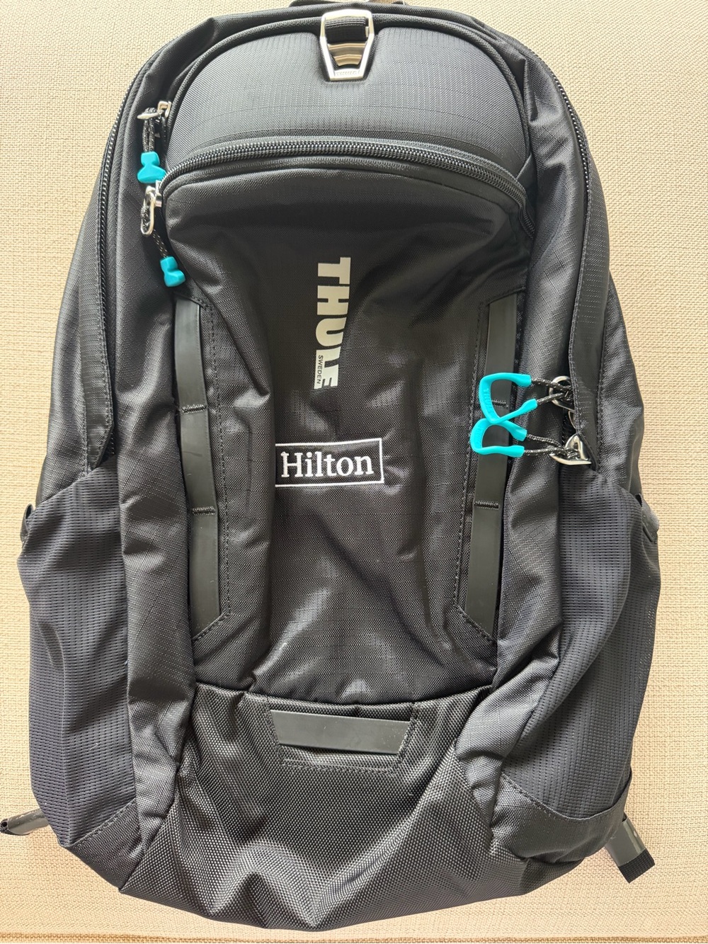 Thule Black Backpack with Aqua Zipper Pulls - Hilton Logo